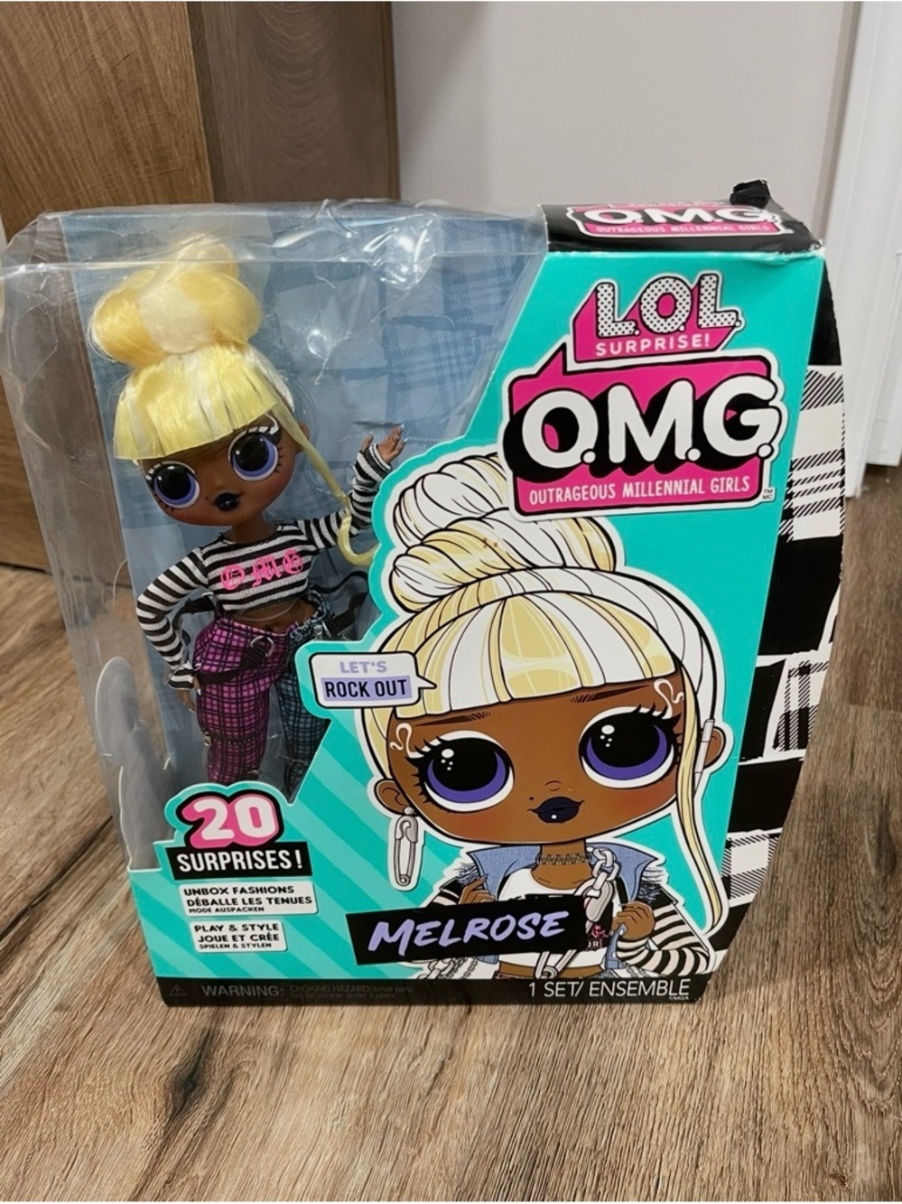 L.O.L. Surprise! Melrose Doll - Blonde Hair, Purple Eyes, Teal Box Accents